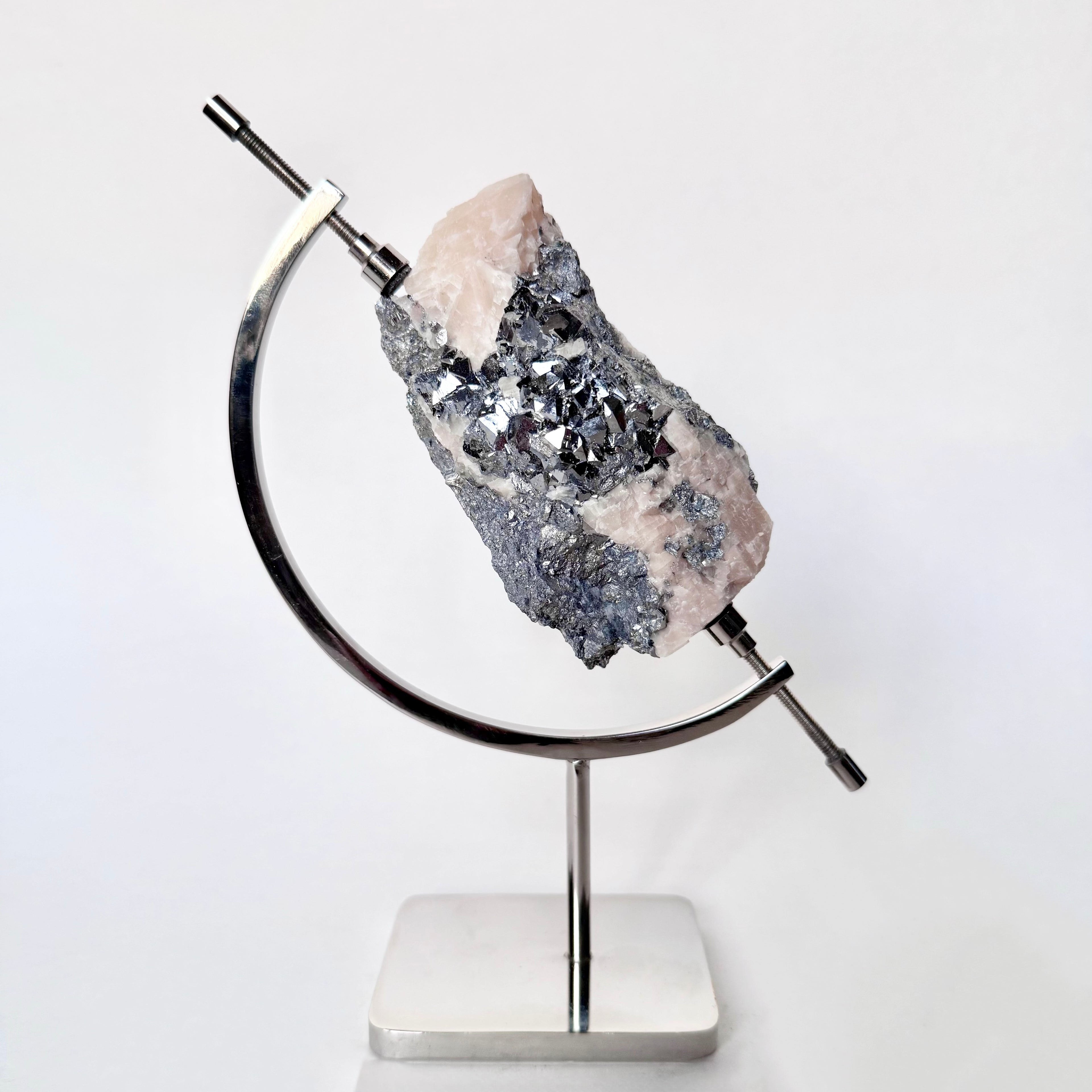 Skutterudite | Blush Calcite + Chrome Arc Stand